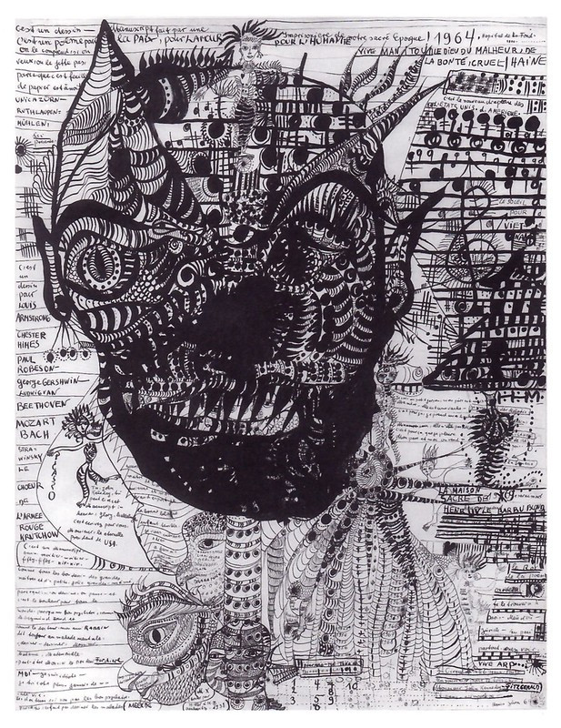 In the center is a large, grotesque head with striped designed throughout and some musical notations. Around the head are small doodles, musical notes, and many scribbled/hard to read words crowding around. The whole scene is chaotic and filled with dark ink lines.